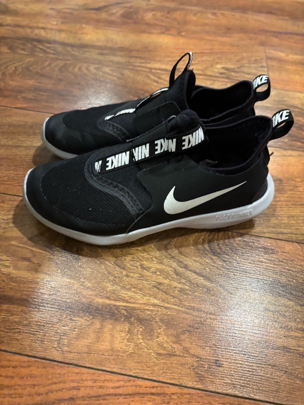 Nike Black Slip-On Sneakers with White Swoosh